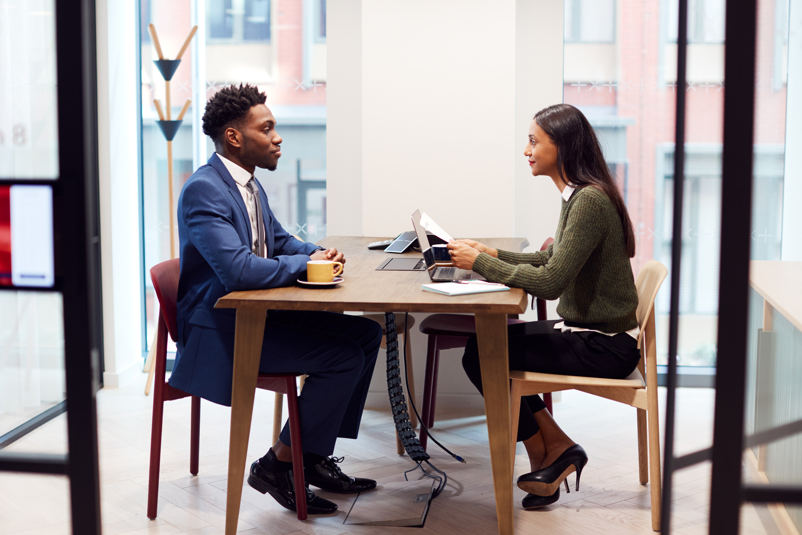 Businesswoman Interviewing Male Job Candidate 